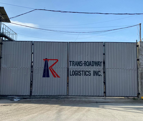 adult repairman holding screwdriver and using digital tablet while repairing washing machine in