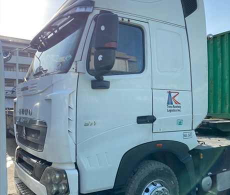 adult repairman holding screwdriver and using digital tablet while repairing washing machine in