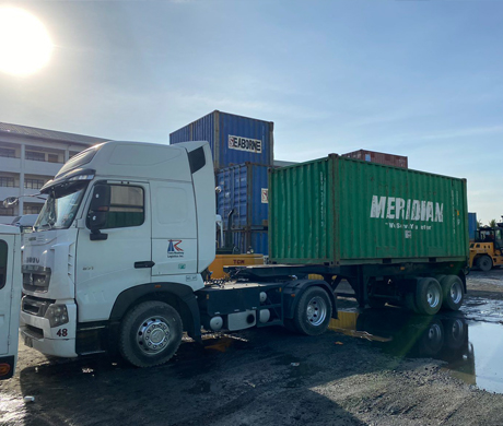 adult repairman holding screwdriver and using digital tablet while repairing washing machine in